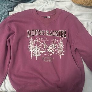 Purple sweatshirt, barely worn, and super confident.